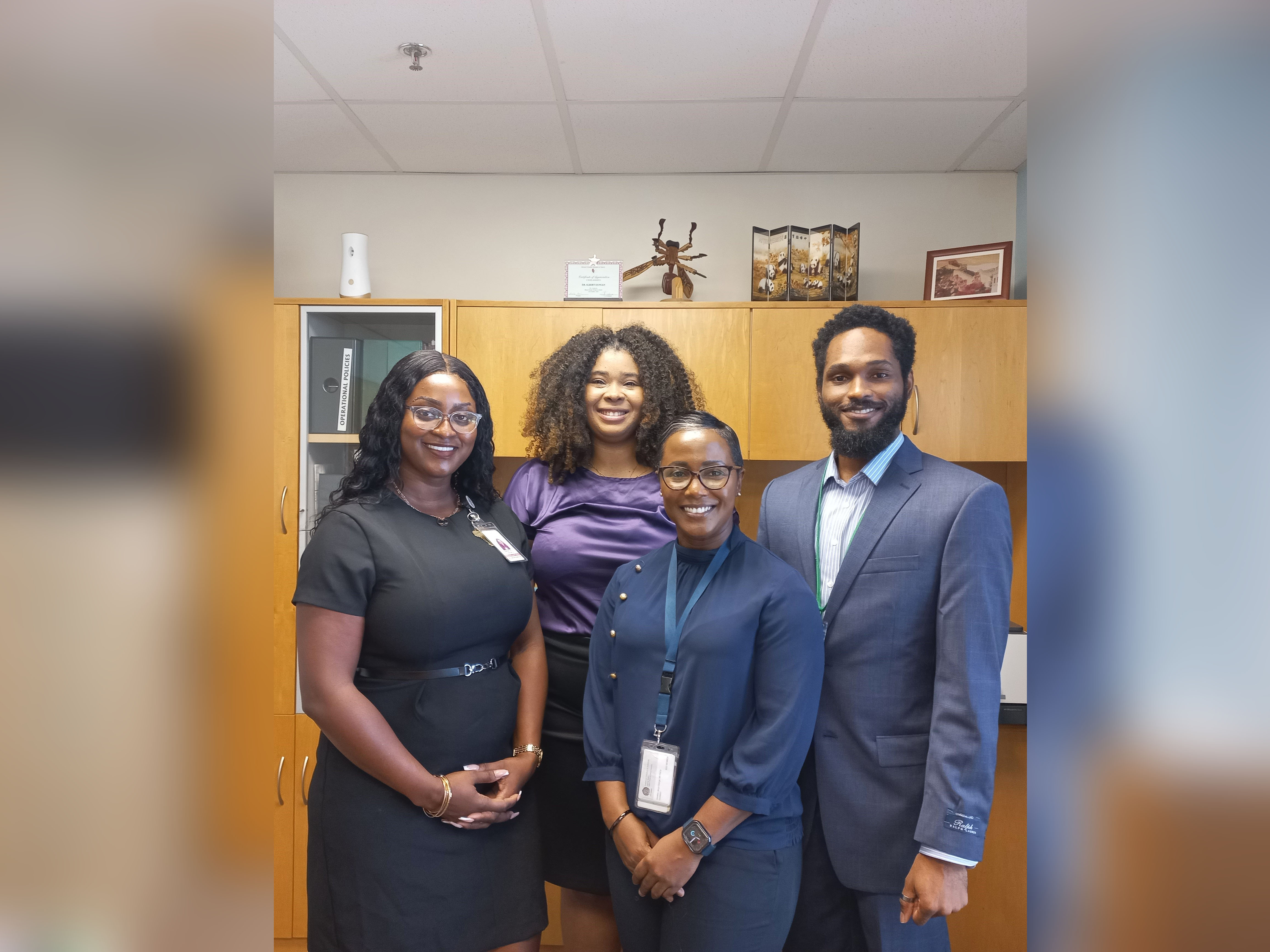 The executive team at the SLBMC pose for a photo with Mrs. Andrea Andrew, Country Coordinator for Antigua and Barbuda within the UN Resident Coordinators Office for Barbados and the Eastern Caribbean. From left to right is Ms. Survia, Mrs. Andrew, Dr. George and Dr. Goodwin.